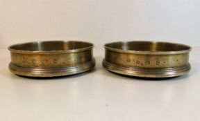 A pair of Birmingham silver wine coasters with woo