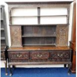 An 18thC. carved oak dresser with three drawers &
