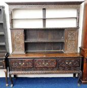 An 18thC. carved oak dresser with three drawers &