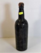A 1950's bottle of port, no label, wax stamp with