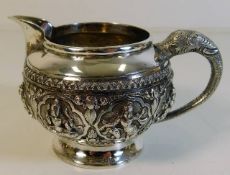 A decorative Asian white metal cream jug 181g