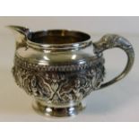 A decorative Asian white metal cream jug 181g