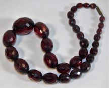 A set of faceted cherry amber style beads approx.