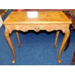 An Edwardian Maple & Co. walnut card table with ca