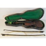 A cased antique violin with one piece back & well