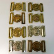 Eight military belt buckles including Irish Guards