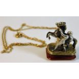 An antique French two colour gold seal depicting Marley Horse on carnelian stamp with French 18ct go