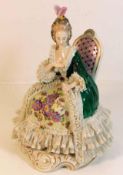A Dresden porcelain seated figure of woman in lace