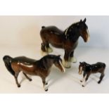 Three Beswick horses, including a shire horse