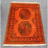 A small antique rug 44in long x 30in wide