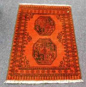 A small antique rug 44in long x 30in wide