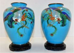 A pair of Chinese cloisonne vases with dragon deco