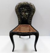 A 19thC. cane seated chair decorated with lacquer