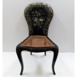 A 19thC. cane seated chair decorated with lacquer