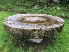 A large granite millstone - viewing at vendor prop