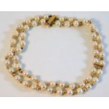 A 9ct gold mounted cultured pearl bracelet 14.5g £