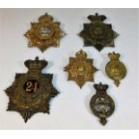 Six various helmet plates & badges