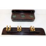 An early 20thC. mahogany billiard cue stand with b