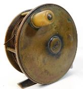 An antique brass fly fishing reel 4.5in diameter