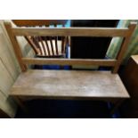 An arts & crafts style oak bench 46in wide x 39in