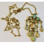 A yellow metal chain & pendant set with fourteen s