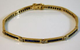 A 14ct gold bracelet set with diamond & sapphire 8