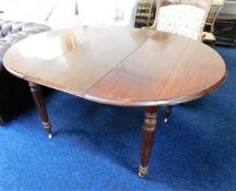 A small 19thC. extending mahogany dining table wit