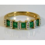 A 9ct gold half eternity ring set with diamond & e