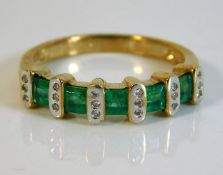 A 9ct gold half eternity ring set with diamond & e