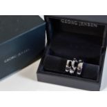 A boxed Georg Jensen "Fusion" three piece ring set