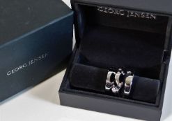 A boxed Georg Jensen "Fusion" three piece ring set