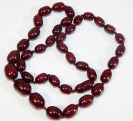 A cherry amber style beaded necklace approx. 30in