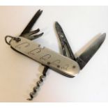 A fishing knife with hook sizes & five tools
