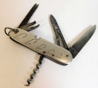 A fishing knife with hook sizes & five tools