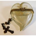 An antique glass heart shaped keepsake with butter