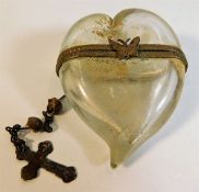 An antique glass heart shaped keepsake with butter