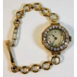 An antique 18ct gold cased 15 jewelled wrist watch