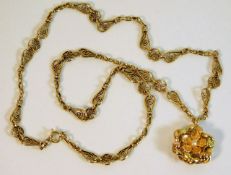 An antique 18ct tested gold French necklace with French two colour gold pendant set with seed pearl