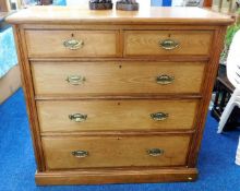 A large c.1900 oak chest of five drawers with bras