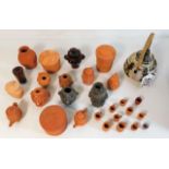 A small studio pottery hettle twinned with a quantity of miniature terracotta items by John Beswick