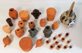 A small studio pottery hettle twinned with a quantity of miniature terracotta items by John Beswick