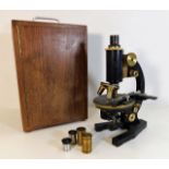 A cased brass Seibert microscope & lenses