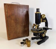 A cased brass Seibert microscope & lenses