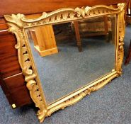 A 19thC. carved wood gilded framed mirror 29in wid