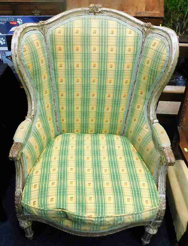 A 19thC. French wing back arm chair 44in high to b