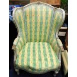 A 19thC. French wing back arm chair 44in high to b
