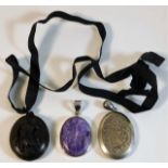 A Victorian carved mourning locket twinned with a