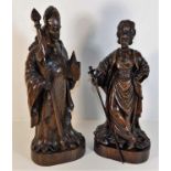 A pair of Black Forest style carved oak figures de