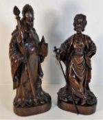 A pair of Black Forest style carved oak figures de