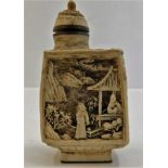 A 20thC. carved resin scent bottle